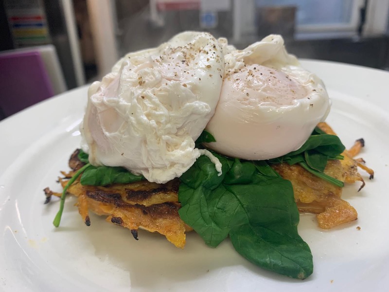 Sweet potato rosti topped with spinach and two poached eggs